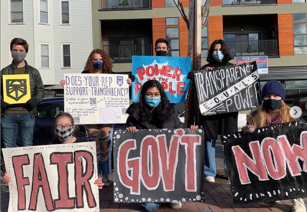 People holding signs